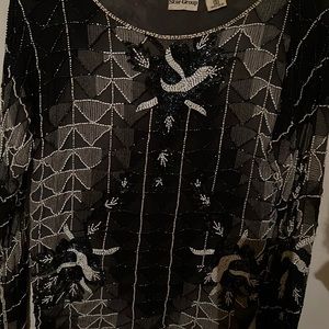 Navy blue all over sequin silk top in size small with long sleeves.